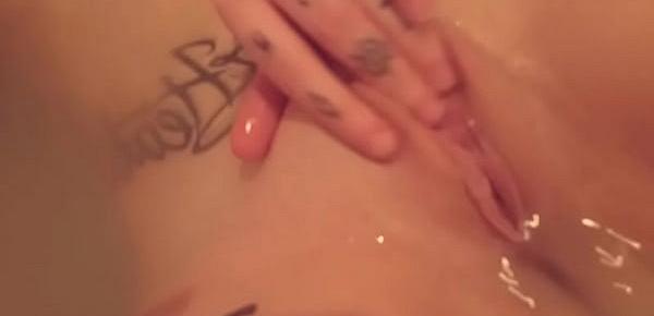  Dahlia Rose plays with her tasty peach in the bathtub